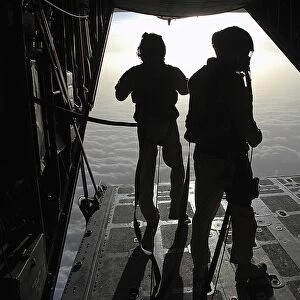 Airmen prepare for a HALO jump aboard an HC-130 over Djibouti