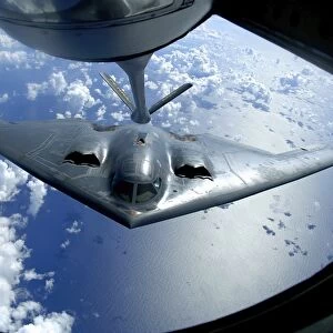 A B-2 Spirit moves into position for refueling from a KC-135 Stratotanker