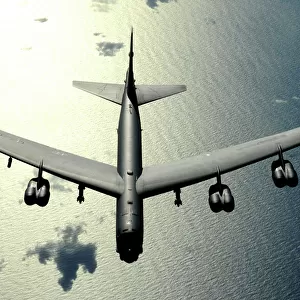 A B-52 Stratofortress in flight over the Pacific Ocean