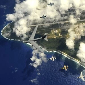 A B-52 Stratofortress leads a formation of aircraft over Guam