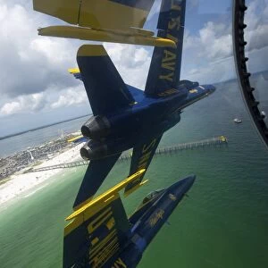 The Blue Angels perform the Diamond 360 maneuver over Florida