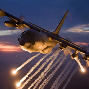 A C-130 Hercules releases flares during a mission over Kansas