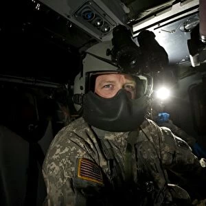 Crew chief in a UH-60 Black hawk helicopter
