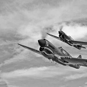 Two Curtiss P-40 Warhawks in flight near Nampa, Idaho