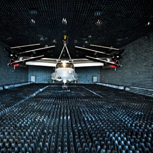 A CV-22 Osprey hangs in the anechoic chamber at Eglin Air Force Base