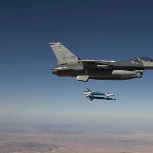 An F-16 Fighting Falcon releases two GBU-12 laser guided bombs