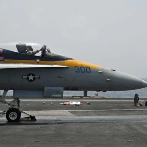 An F / A-18C Hornet launches from the flight deck of USS Nimitz
