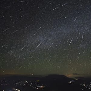 The Geminids meteor shower streaks across the clear sky above Yunnan province of China