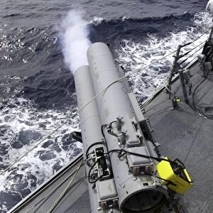 The guided missile destroyer USS Mustin (DDG-89), test fires the MK-32 Mod-15 Torpedo