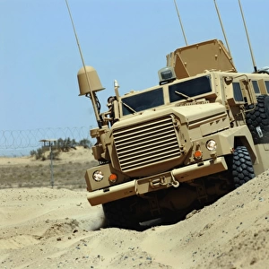The Joint Explosive Ordnance Disposal Rapid Response Vehicle navigates over rough terrain