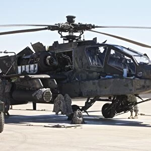 Maintenance being conducted on an AH-64D Apache Longbow