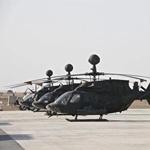 OH-58D Kiowa helicopters on the flight line at COB Speicher, Iraq