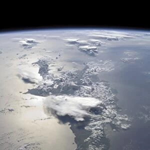 A panoramic view of the island of Hispaniola in the foreground and Cuba extending