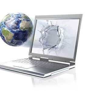 Planet Earth globe coming out from a laptop computer