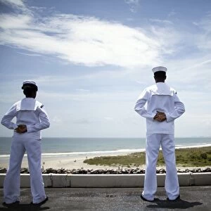 Sailors man the rails as the ship pulls into Naval Station Norfolk
