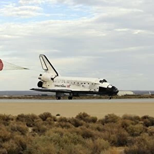 Space Shuttle Discovery deploys its drag chute as the vehicle comes to a stop