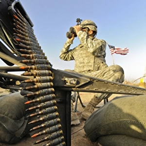 U. S. Army soldier scouts for enemy activity during an operation in Afghanistan