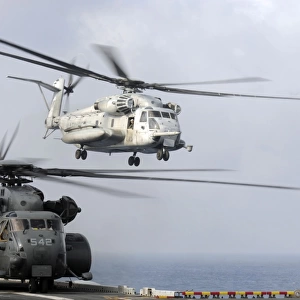 A U. S. Marine Corps CH-53E Sea Stallion helicopter taking off from USS Essex in the