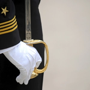 A U. S. Naval Academy midshipman stands at attention