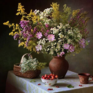 With a bouquet of meadow flowers and berries
