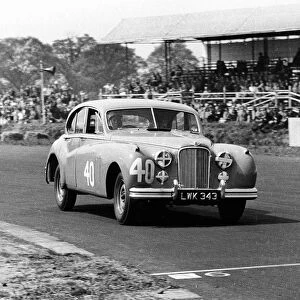 1953 Jaguar MkVII, Stirling Moss at Silverstone. Creator: Unknown