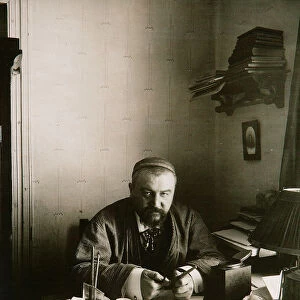 Alexander Kuprin, Russian author, at his desk, Gatchina, Russia, early 20th century. Artist: Karl Karlovich Bulla