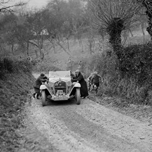 Alfa Romeo of KD Evans getting a push at the NWLMC London-Gloucester Trial, 1931