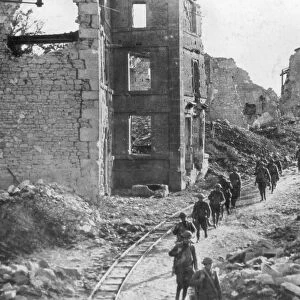 American soldiers passing through the ruins of Varennes, Meuse-Argonne Offensive, France, 1918