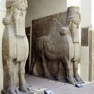 Assyrian sculptures of human-headed winged bulls at the palace gateway, Khorsabad, c8th century BC