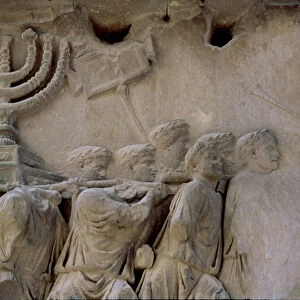 Basrelief in the Arch of Titus representing men carrying a menorah, located in the