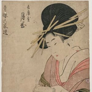 The Courtesan Tsukioka of Hyogoya Rolling a Letter…, late 1790s. Creator: Kitagawa Utamaro