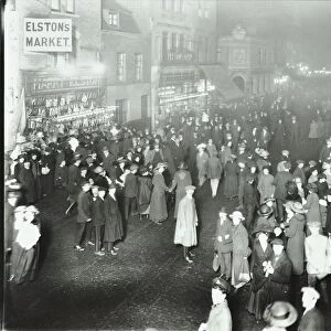 Crowds in Deptford High Street shopping after dark, London, 1913
