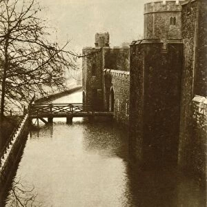 Flood waters in the moat at the Tower of London, 1928, (1935). Creator: Unknown