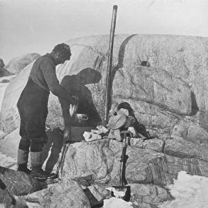 Forde Cooking Seal-Fry on the Blubber Stove at Cape Roberts, c1911, (1913). Artist
