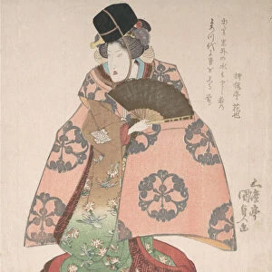 Kabuki Actor in a Female Role Standing with a Fan, 19th century. 19th century