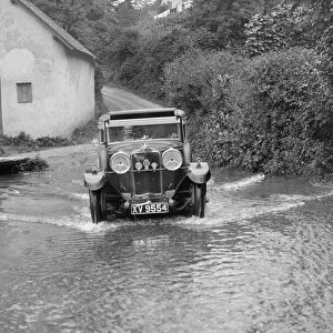 Kitty Brunell fording the River Exe in a Talbot 14 / 45 sportsmans coupe, Winsfors
