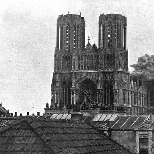La destruction methodique de Reims; L'eclatement d'un obus de gros calibre sur le transept... 1917 Creator: Unknown