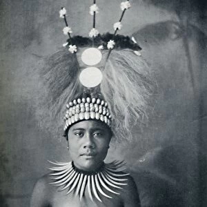 A Samoan woman wearing a collar of cachalots teeth and a ceremonial headdress, 1902. Artist: Josiah Martin
