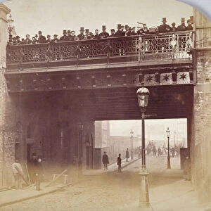 View of figures looking over the south side of Shoe Lane Bridge, City of London, 1869