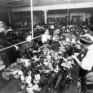 Women sewing teddy bears in a factory, c. 1915