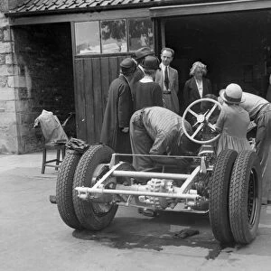 Working on Raymond Mays Vauxhall-Villiers, c1930s. Artist: Bill Brunell