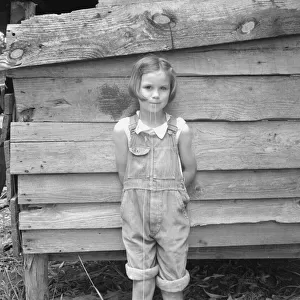 Eight year old daughter who helps about the tobacco barn... Granville County, North Carolina, 1939. Creator: Dorothea Lange