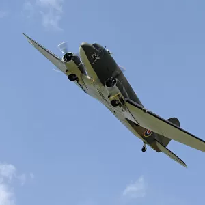 A Douglas C-47 Dakota of the Battle of Britain Memorial Flight, is shown flying in