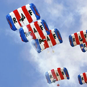 Parachutists from the Royal Air Forces Falcons Display Team, drift gently back
