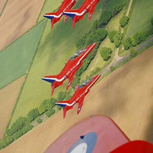 The Red Arrows practice a display over their home base of RAF Scampton in Lincolnshire