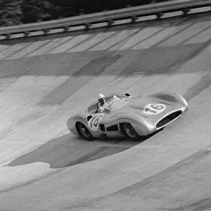 1955 Italian Grand Prix: Stirling Moss, retired, on the banking, action