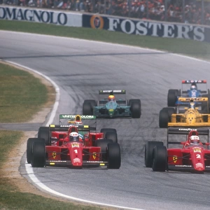 1990 San Marino Grand Prix: Nigel Mansell and Alain Prost side by side going into Tosa on the first lap at the start