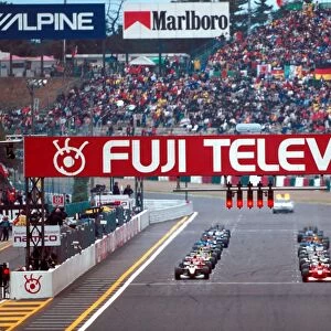 2000 Japanese Grand Prix: Michael Schumacher on pole with Mika Hakkinen next to him on the front row of the grid at the start