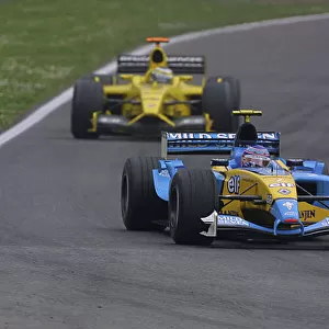 2003 San Marino Grand Prix - Sunday Race, Imola, Italy. 20th April 2003. Jarno Trulli, Renault R23, leads Giancarlo Fisichella, Jordan Ford EJ13, action. World Copyright LAT Photographic. ref: Digital Image Only