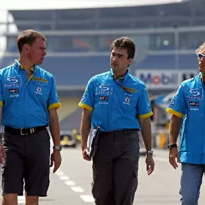 Formula One World Championship: Alan Permane Renault Race Engineer, Nick Chester Renault and Jarno Trulli Renault walk the circuit